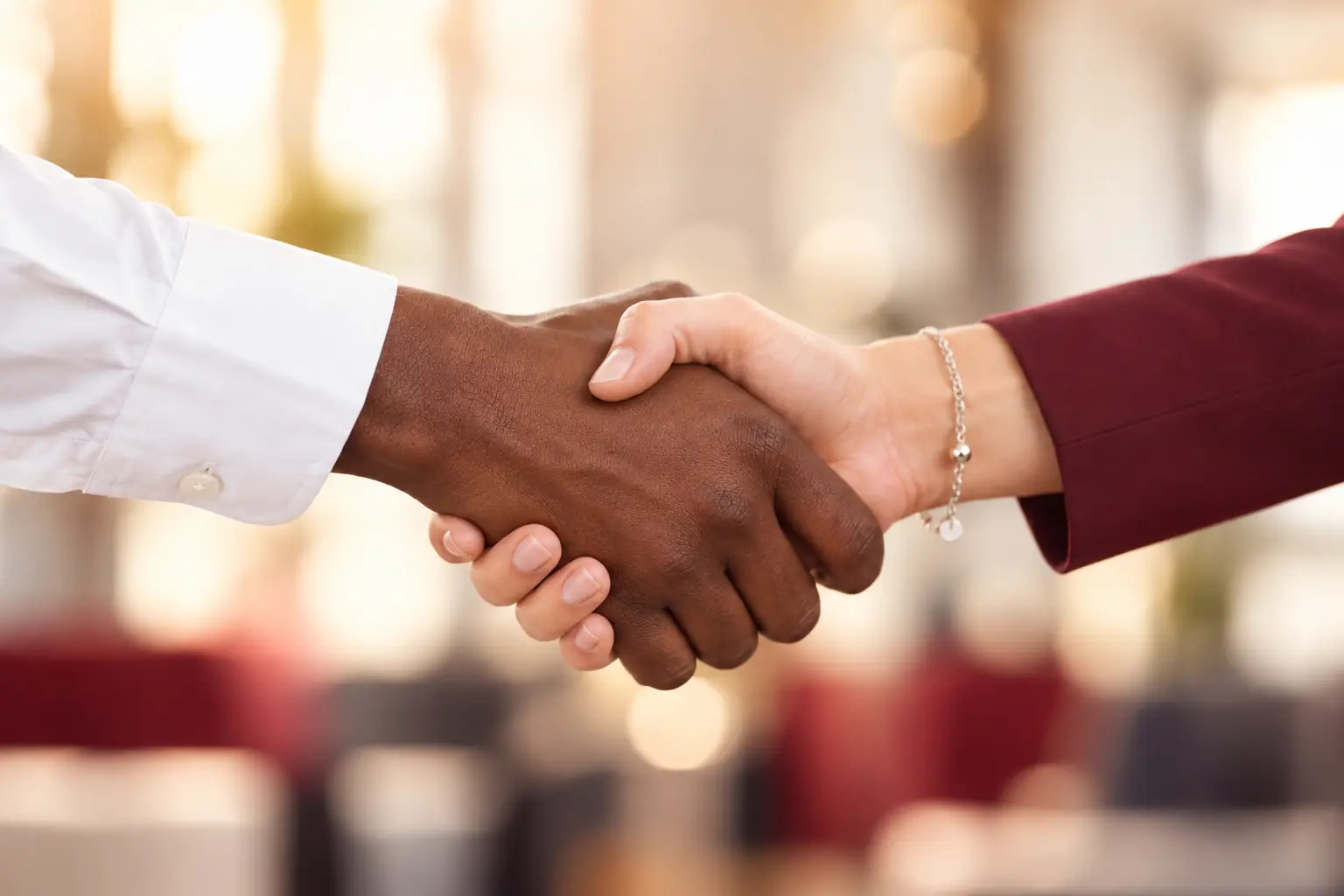 Invictus FC partnership handshake